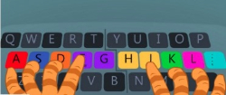 keyboard with coloured keys and someone typing 